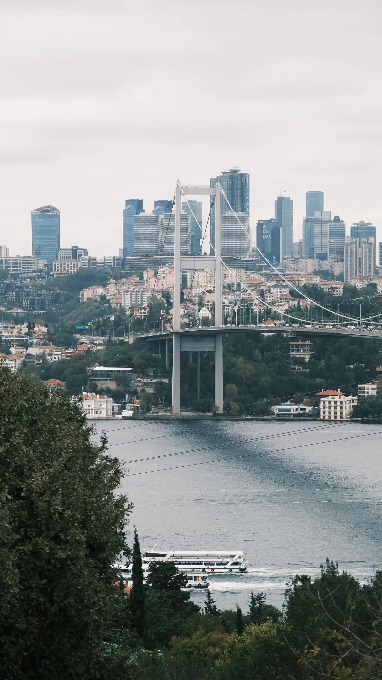 Bosphorus suspension bridge backed by Istanbul's modern skyline